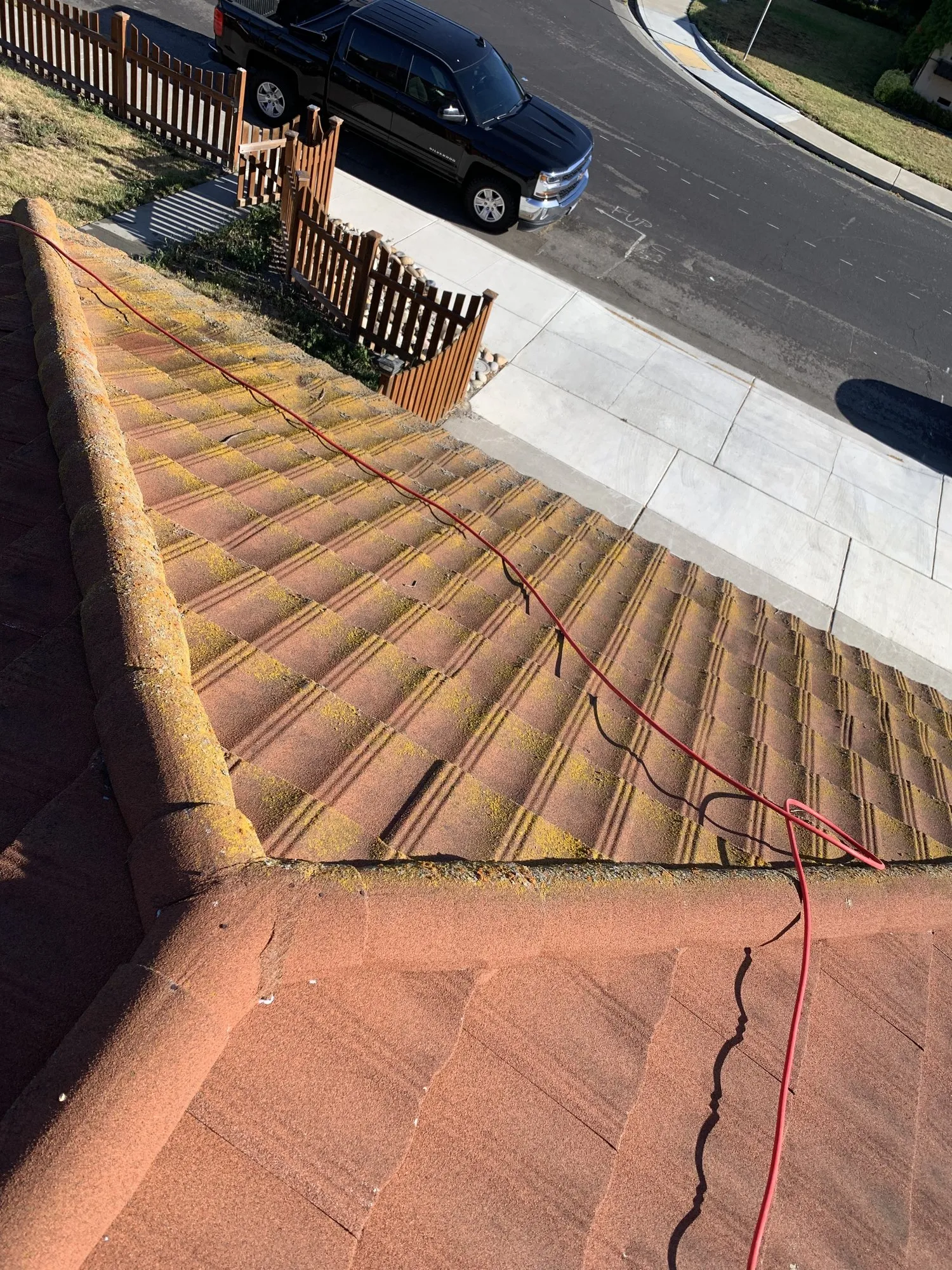 Half cleaned tile roof